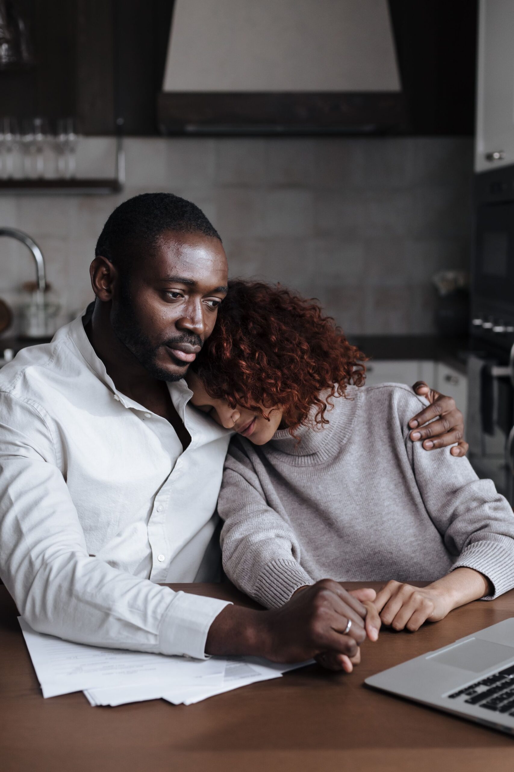 Couple sharing a compassionate conversation during grief