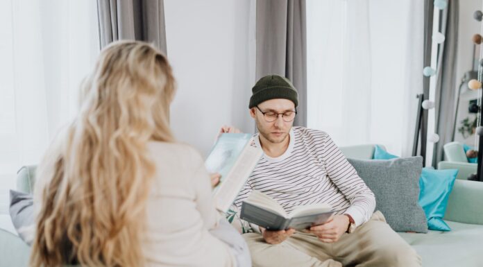 Couple enjoying quiet reading time together at home