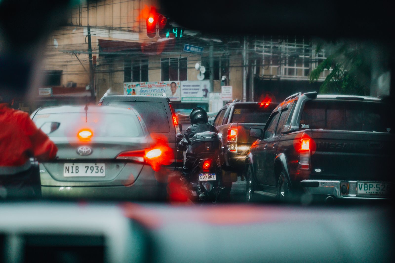 Traffic seen through a windshield during a long evening commute