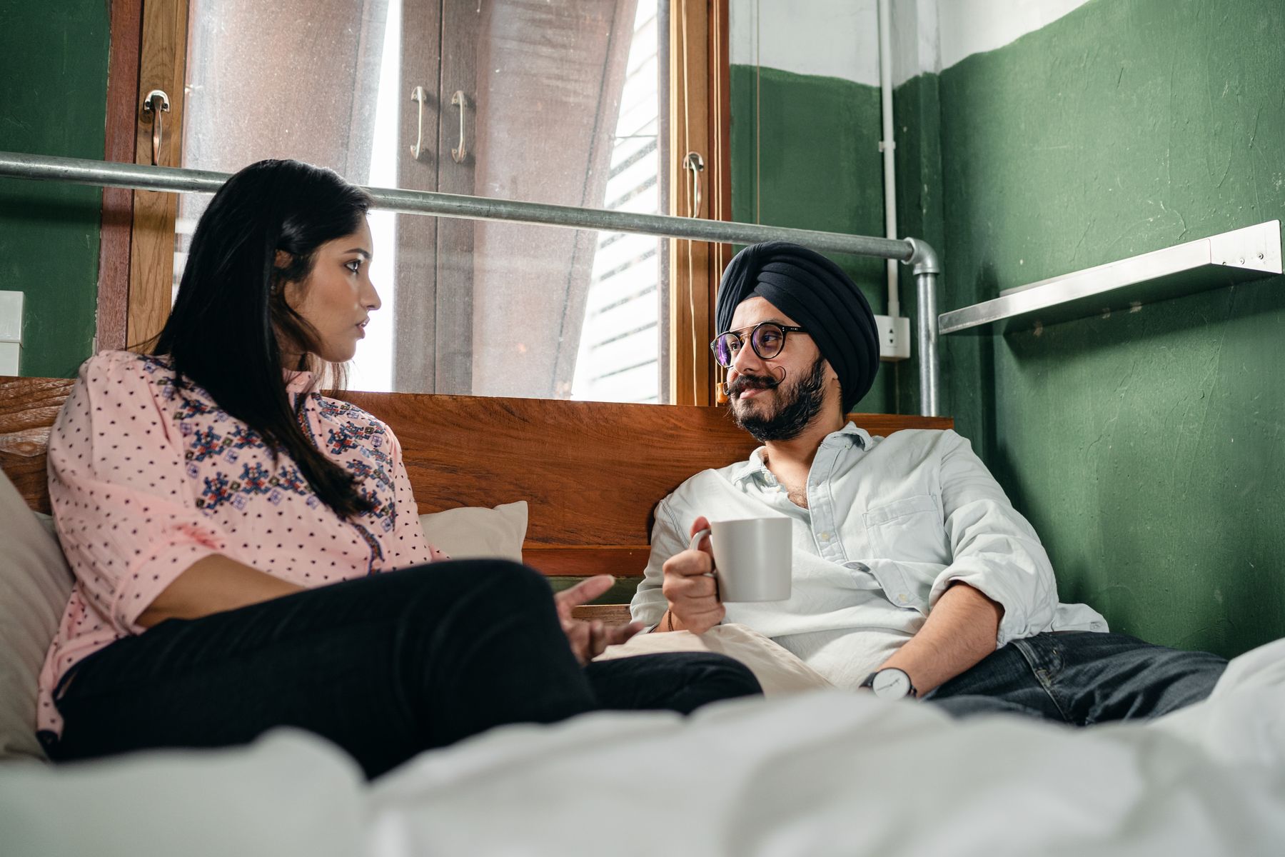 Couple sharing a morning check-in despite opposite schedules