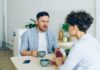 When Your Partner Is Always Late: How to Address Chronic Lateness Without Parenting Each Other Couple having a serious conversation about repeated lateness
