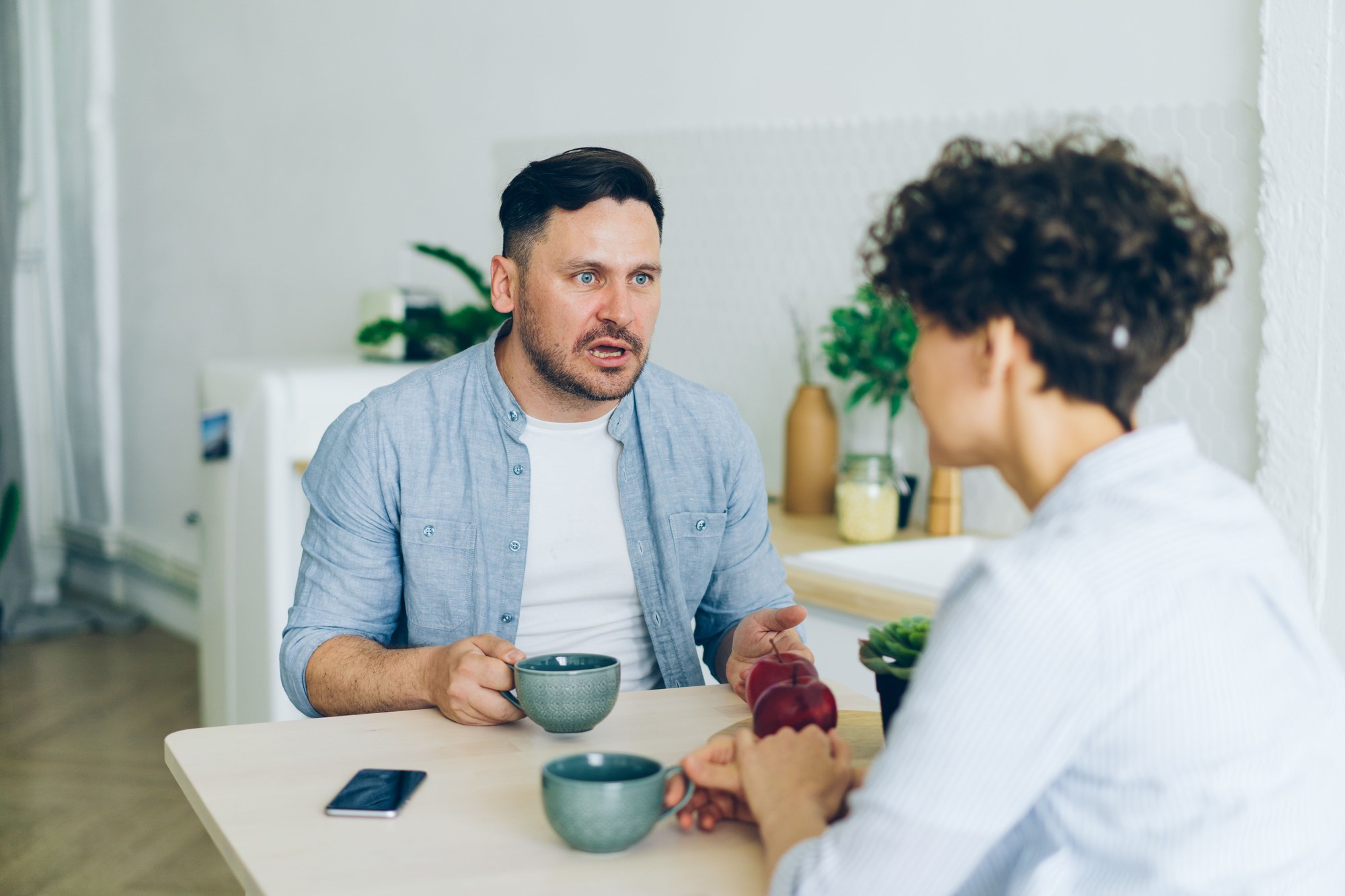 Couple having a serious conversation about repeated lateness