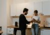 Couple discussing access to private text messages on a phone