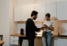 Couple discussing access to private text messages on a phone