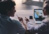 When Your Partner Has a Work Spouse: How to Discuss Boundaries Without Making Accusations Two coworkers having a professional conversation in an office