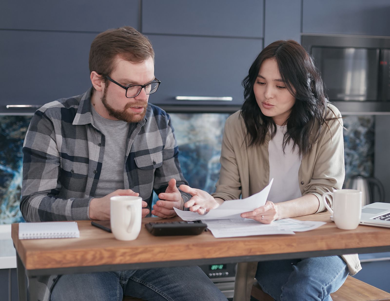 Couple having a serious but respectful conversation about a prenuptial agreement