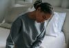 How to Support a Grieving Partner Without Trying to Fix Their Pain Partner offering quiet comfort to a grieving spouse at home