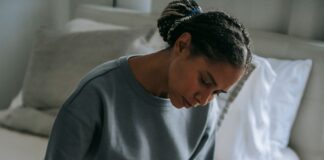 Partner offering quiet comfort to a grieving spouse at home