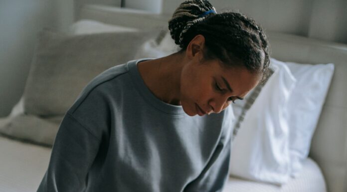 Partner offering quiet comfort to a grieving spouse at home