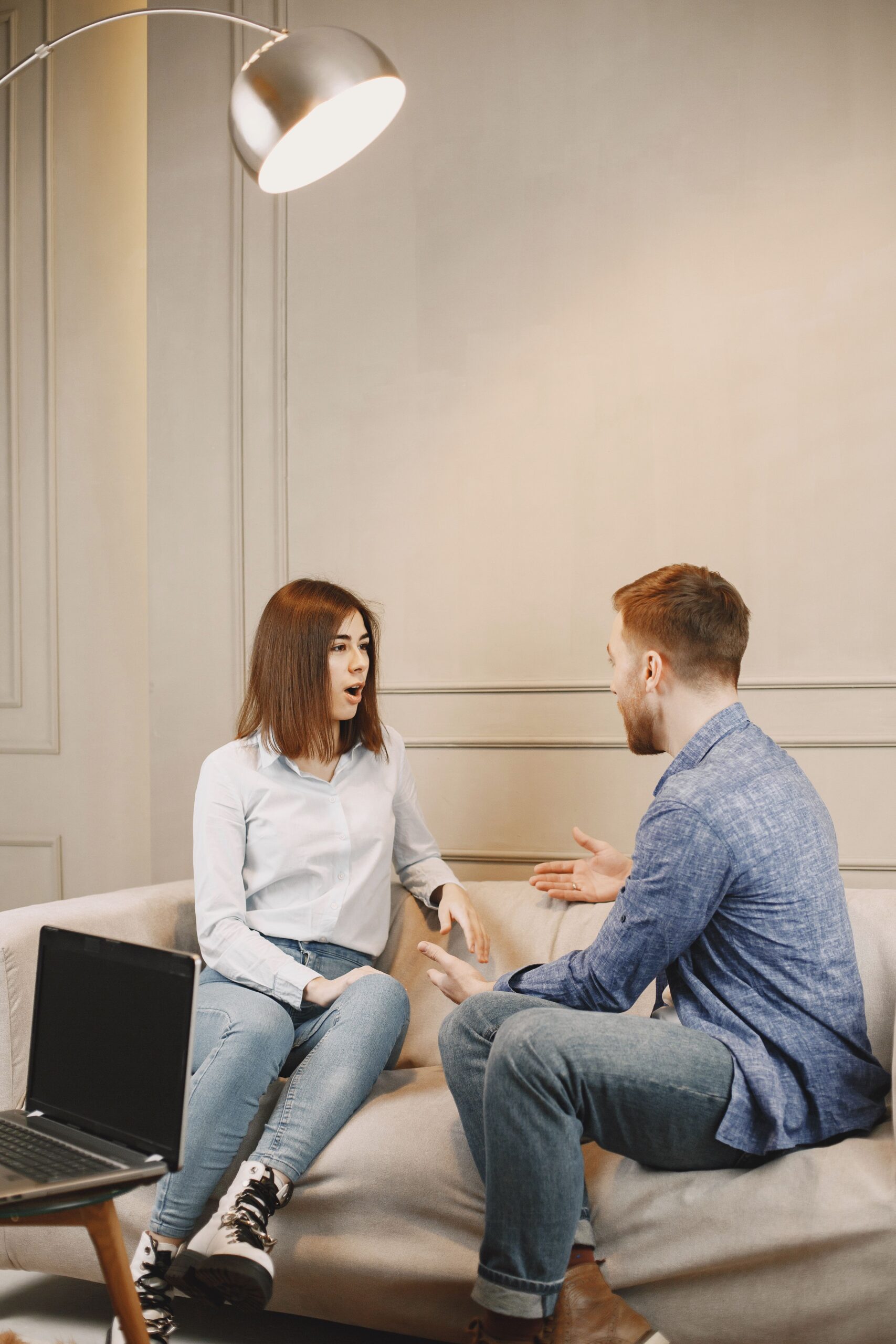 Couple having a calm conversation after one partner loses a job