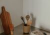Clean kitchen counter with utensils after a household reset