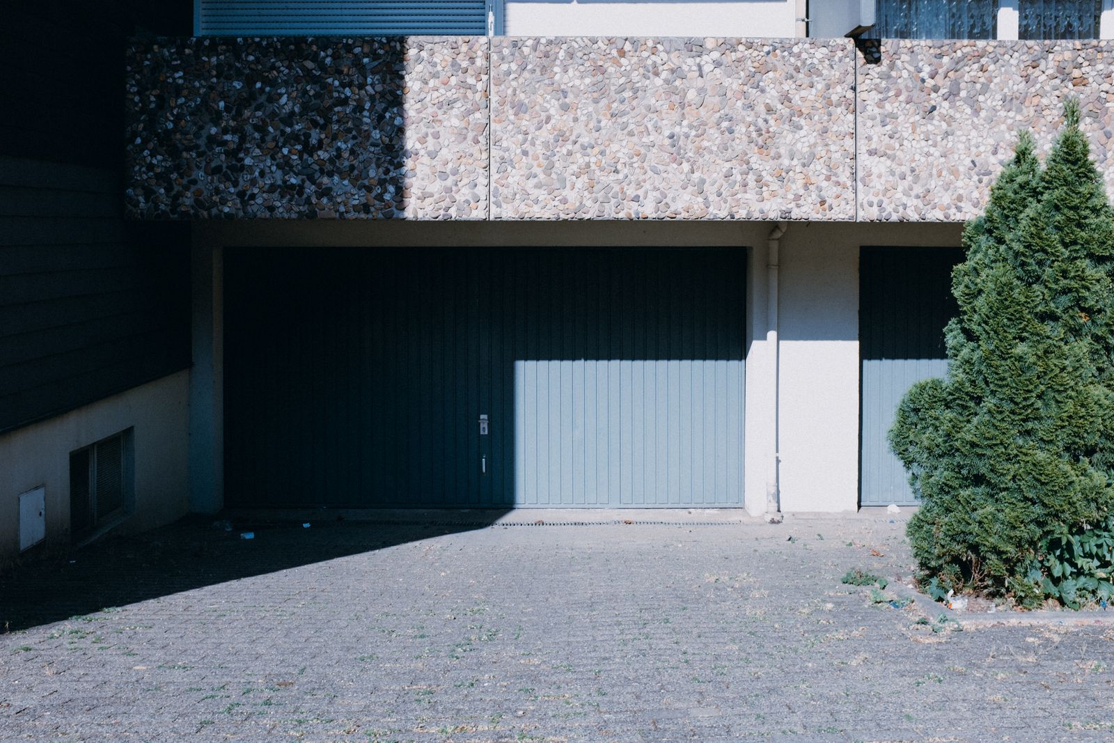 Closed residential garage door after a household security check