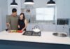 Couple cooking together while sharing responsibility for kitchen cleanup