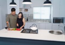 When Your Partner Leaves Food Splattered in the Microwave: A Shared Cleanup Rule Couple cooking together while sharing responsibility for kitchen cleanup
