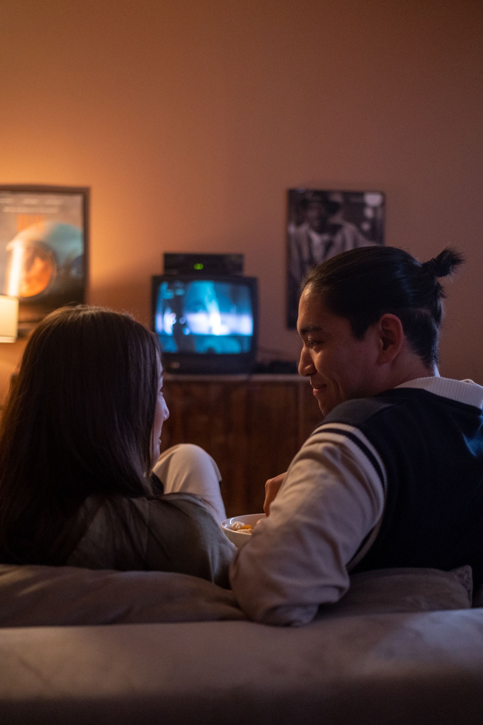Couple sharing a relaxed movie night on the couch