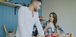 Couple calmly discussing a shared bathroom routine at home