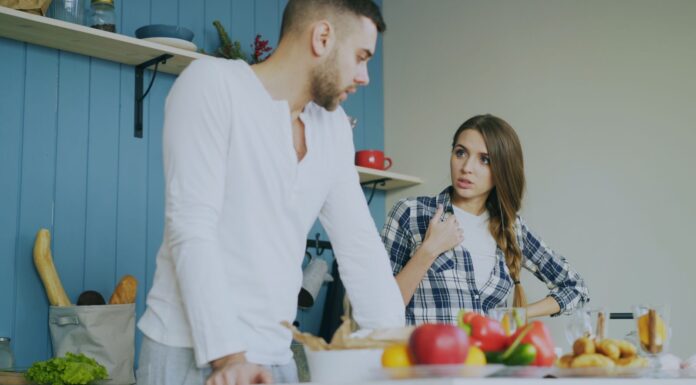 Couple calmly discussing a shared bathroom routine at home