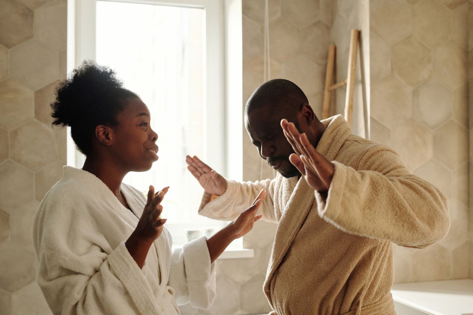 Couple discussing their morning bathroom and hot water routine