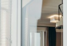 When Your Partner Leaves the Windows Open: How to Agree on Airflow Without Risking Home Safety Couple at home discussing an open window routine
