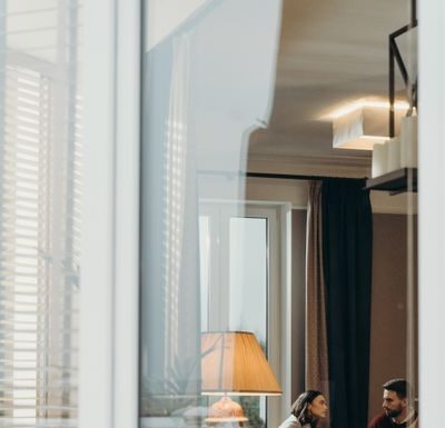 When Your Partner Leaves the Windows Open: How to Agree on Airflow Without Risking Home Safety Couple at home discussing an open window routine