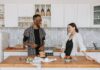 When Your Partner Leaves the Refrigerator Door Open: How to Protect Food and Share the Check Couple discussing a refrigerator door closing routine in their kitchen