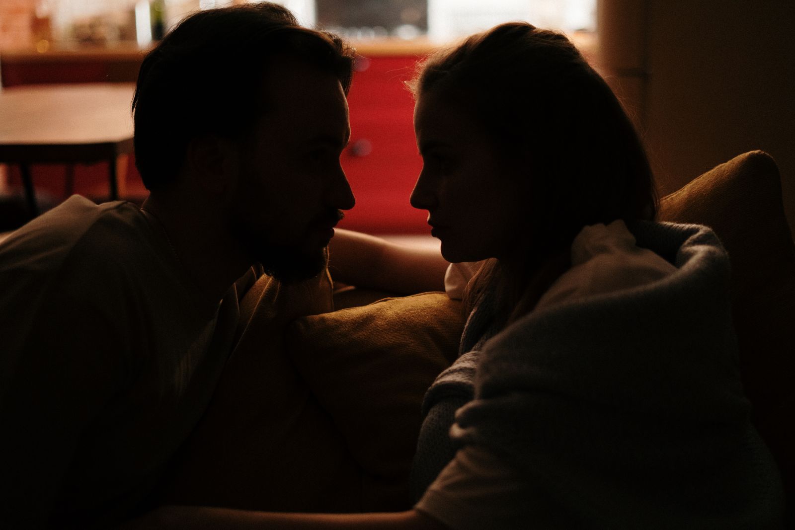 Couple discussing how repeated morning alarms affect their sleep