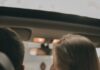 Couple sitting together in their shared car