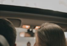 When Your Partner Returns the Car With an Empty Gas Tank: How to Share Fuel Responsibility Couple sitting together in their shared car