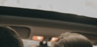 Couple sitting together in their shared car