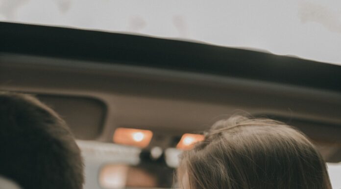 Couple sitting together in their shared car