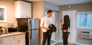 Couple discussing their shared water pitcher routine in the kitchen