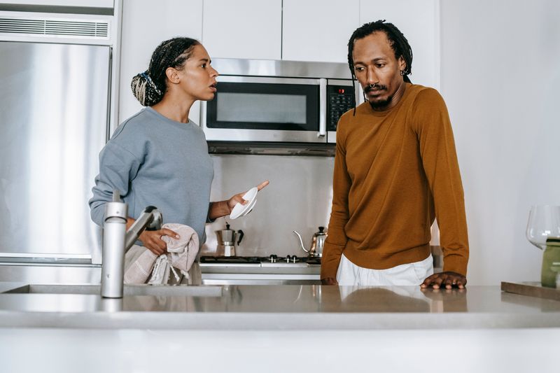 Couple reviewing a kitchen routine together at home