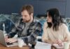 Couple reviewing plans together on a laptop at home