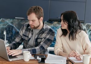 When Your Partner Makes Plans Without Checking With You: Use a Shared Calendar Rule Couple reviewing plans together on a laptop at home