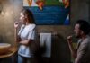 When You and Your Partner Squeeze the Toothpaste Differently: How to End the Bathroom Argument Couple brushing their teeth together during a shared bathroom routine