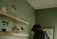 When Your Partner Leaves Used Coffee Grounds in the Coffee Maker: A Simple Cleanup Rule Couple making coffee together beside a coffee machine in their kitchen