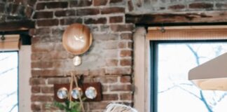 Couple cooking together beside a stovetop before sharing the kitchen cleanup
