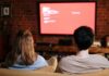 When Your Partner Talks Through Movies: How to Enjoy TV Together Without Fighting Couple watching a movie together at home