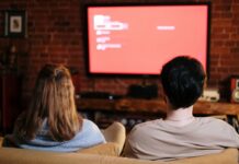 Couple watching a movie together at home