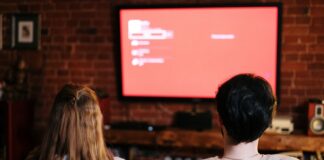 Couple watching a movie together at home