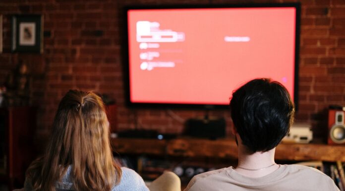 Couple watching a movie together at home