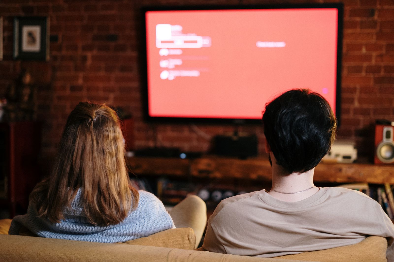 Couple watching a movie together at home