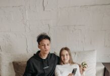 When Your Partner Keeps Misplacing the TV Remote: How to End the Search-and-Blame Cycle Couple relaxing on a sofa while watching television with a remote control