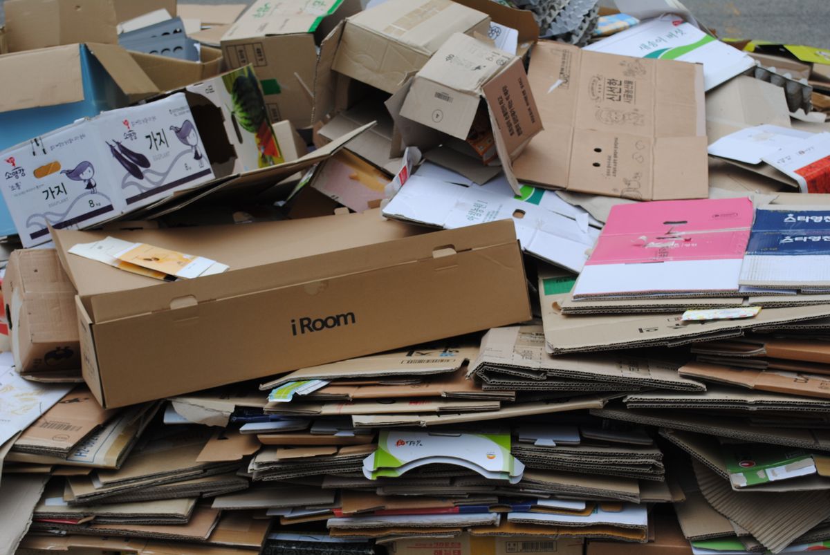 Flattened and used cardboard boxes prepared for household recycling