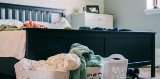 Laundry baskets beside a bed for an easy clothing routine