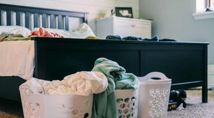 Laundry baskets beside a bed for an easy clothing routine