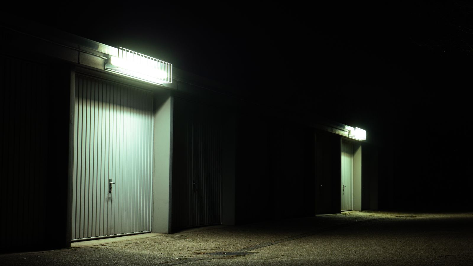 Open garage door at night that needs to be secured