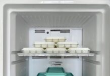 Organized ice cube trays inside a home freezer