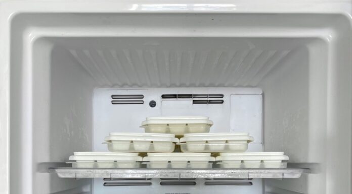 Organized ice cube trays inside a home freezer