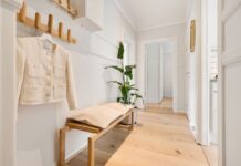 Organized shoe storage in a clear home hallway